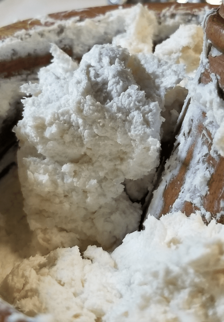 A mortar full of soap goo that no longer looks like frosting, but rather creamed butter.