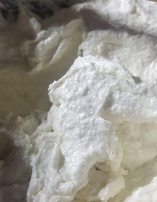 A photograph of sticky, white soap mix.