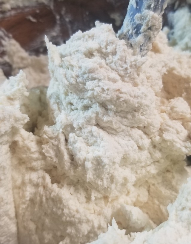 Photograph of a white soap mix, looking similar to creamed butter.